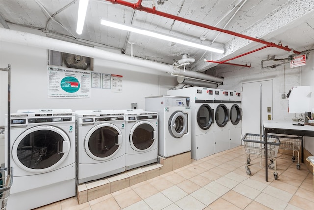 community laundry room featuring separate washer and dryer