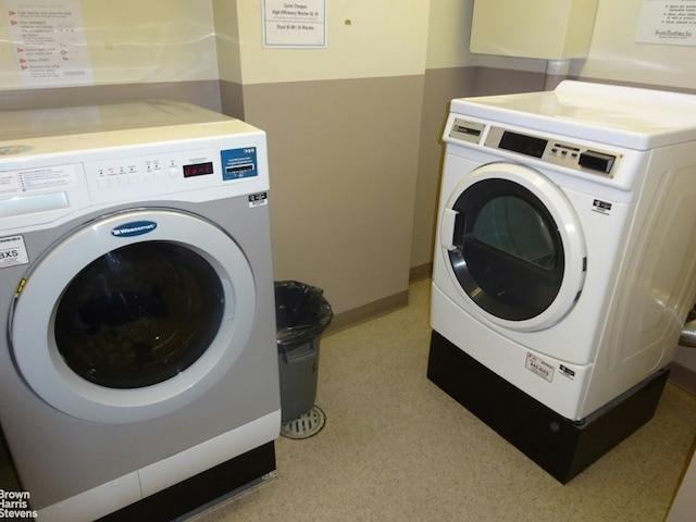 laundry area with washing machine and dryer