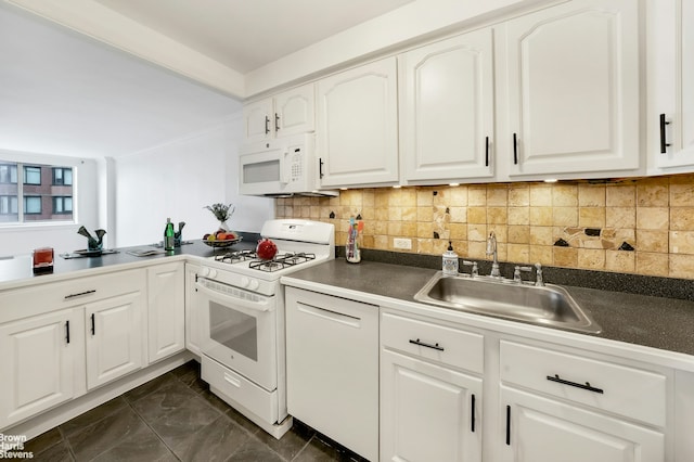 kitchen featuring a sink, decorative backsplash, white appliances, and dark countertops