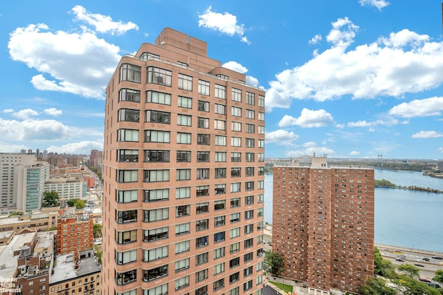 view of property with a view of city and a water view