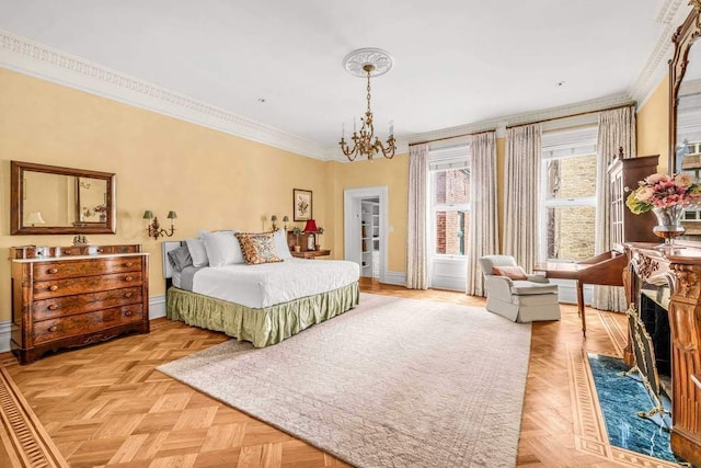 bedroom featuring an inviting chandelier, baseboards, and ornamental molding