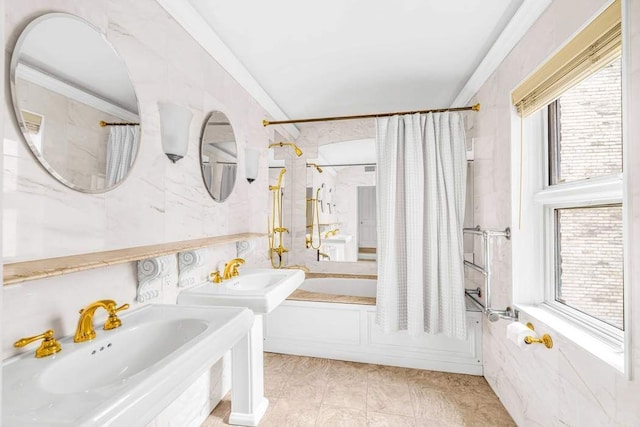 full bathroom featuring crown molding, tile walls, shower / tub combo, and a sink