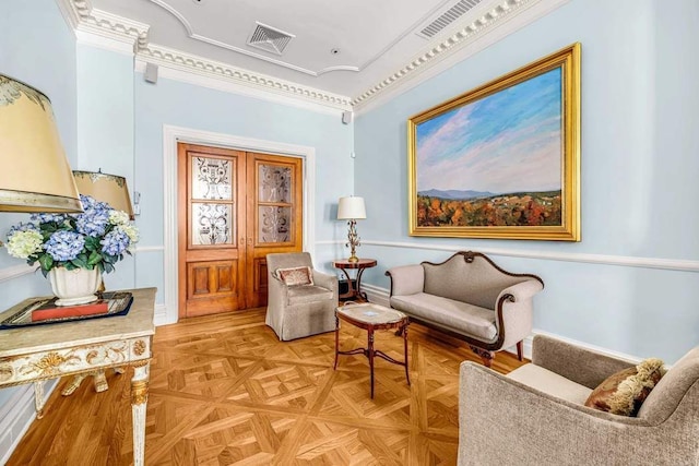 sitting room featuring visible vents and baseboards