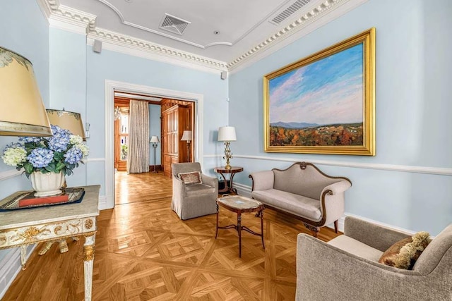 living area with visible vents and baseboards