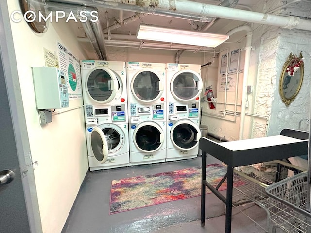 245 W 115th St Unit 16, New York City, NY 10026 - shared laundry featuring stacked washer / drying machine and washing machine and clothes dryer