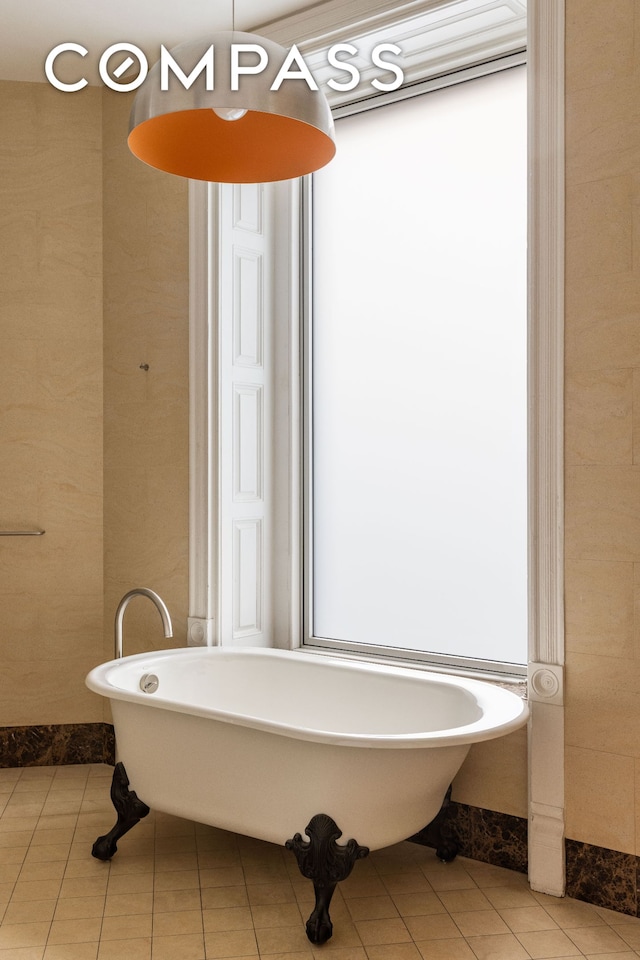 515 Broadway Unit 4B, New York City, NY 10012 - bathroom with tile patterned flooring and a freestanding tub