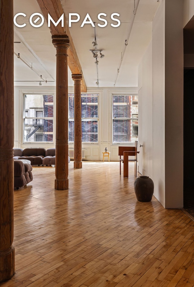 515 Broadway Unit 4B, New York City, NY 10012 - interior space with decorative columns, rail lighting, hardwood / wood-style floors, and plenty of natural light