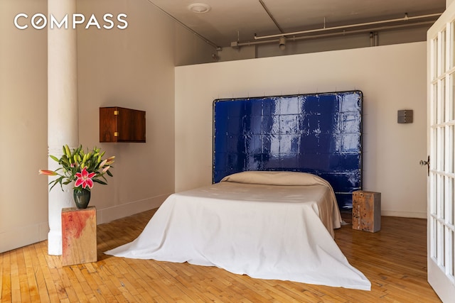515 Broadway Unit 4B, New York City, NY 10012 - bedroom featuring hardwood / wood-style flooring and baseboards
