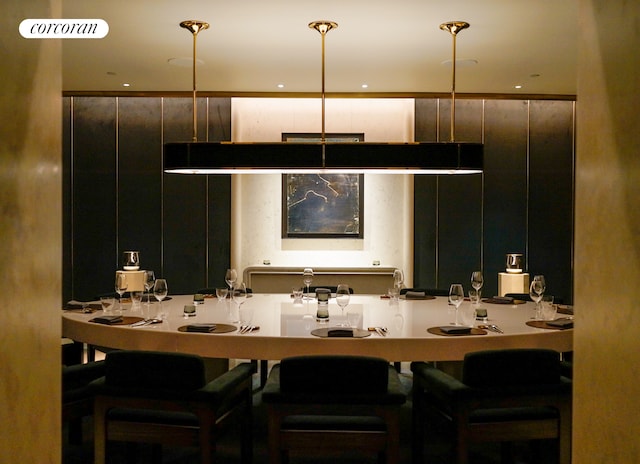 kitchen with decorative light fixtures and a breakfast bar