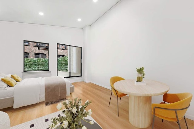 bedroom featuring recessed lighting, light wood-type flooring, and baseboards