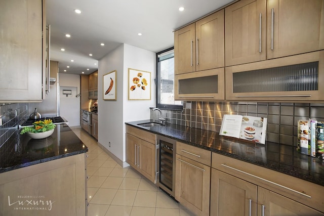 255 E 49th St Unit 31Abf, New York City, NY 10022 - kitchen with wine cooler, a sink, recessed lighting, dark stone countertops, and backsplash