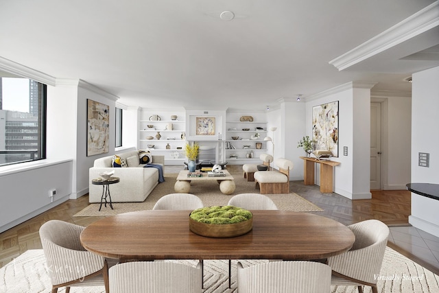 dining space featuring built in shelves, crown molding, and baseboards