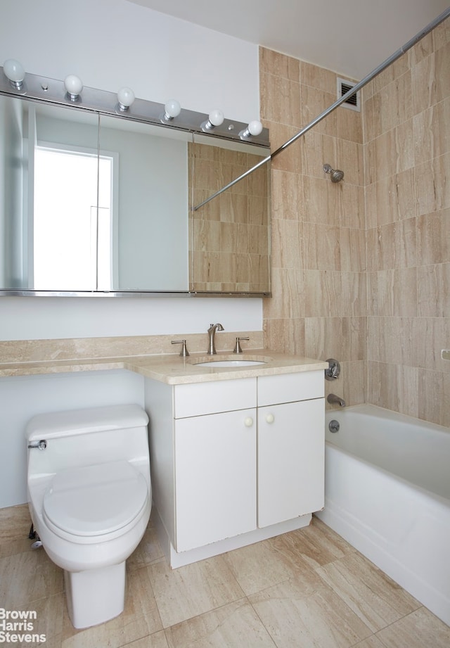 full bath featuring vanity, toilet, and shower / bath combination