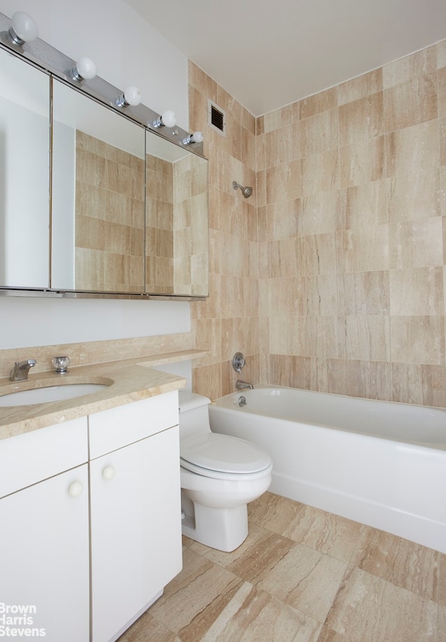 full bathroom with vanity, toilet, tub / shower combination, and visible vents