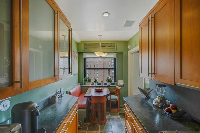 interior space featuring visible vents and stone finish floor