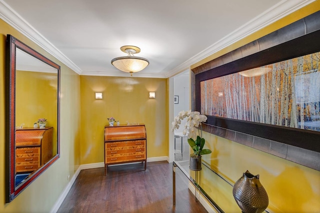 hallway with crown molding, wood finished floors, and baseboards