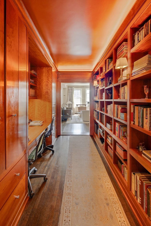 office with dark wood-style floors and ornamental molding