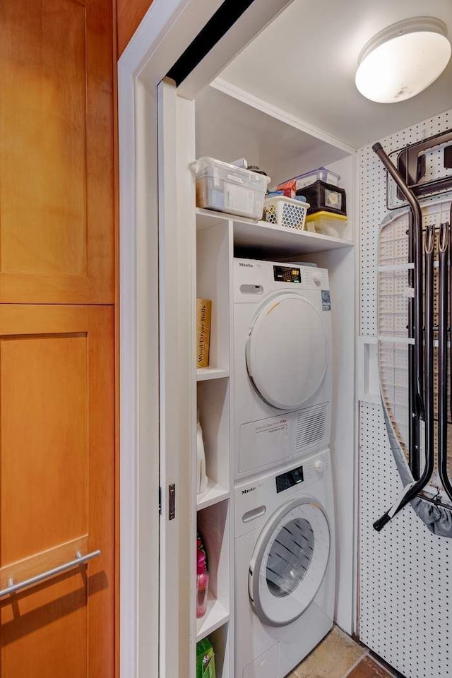 laundry area with laundry area and stacked washing maching and dryer