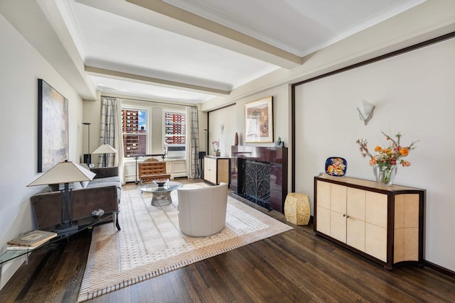 living area featuring beamed ceiling, hardwood / wood-style floors, and crown molding