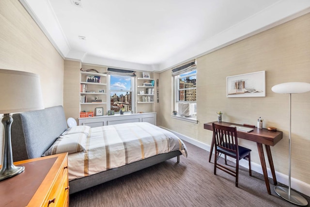 carpeted bedroom featuring baseboards