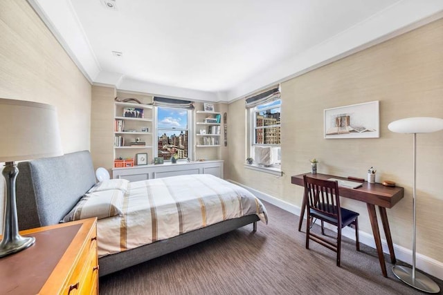 bedroom with crown molding, carpet, and baseboards