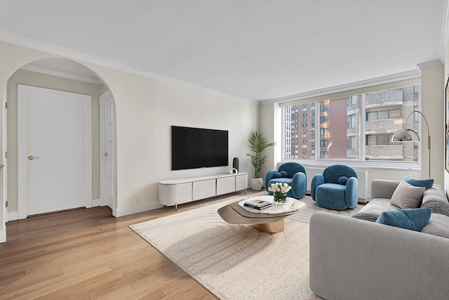 61 W 62nd St Unit 12G, New York City, NY 10023 - living room featuring arched walkways, light wood finished floors, crown molding, and baseboards