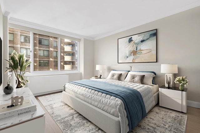 61 W 62nd St Unit 12G, New York City, NY 10023 - bedroom with crown molding, wood finished floors, and baseboards