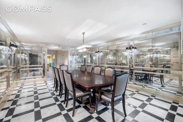 dining room featuring crown molding