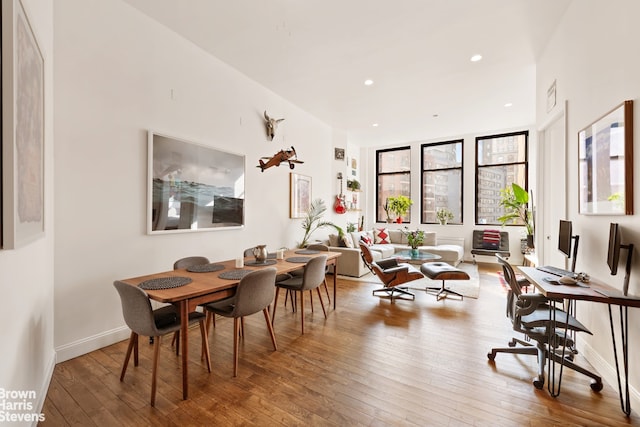 dining space featuring recessed lighting, baseboards, and hardwood / wood-style floors