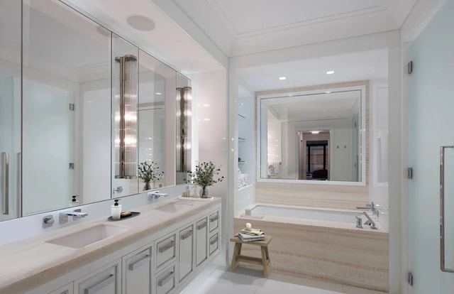 bathroom featuring a garden tub, a sink, and double vanity