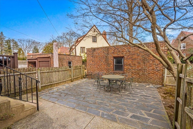 view of patio / terrace featuring outdoor dining space and a fenced backyard