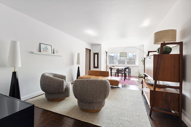 living room featuring baseboards