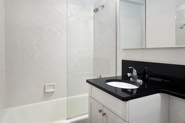 full bath featuring shower / bath combination, backsplash, and vanity