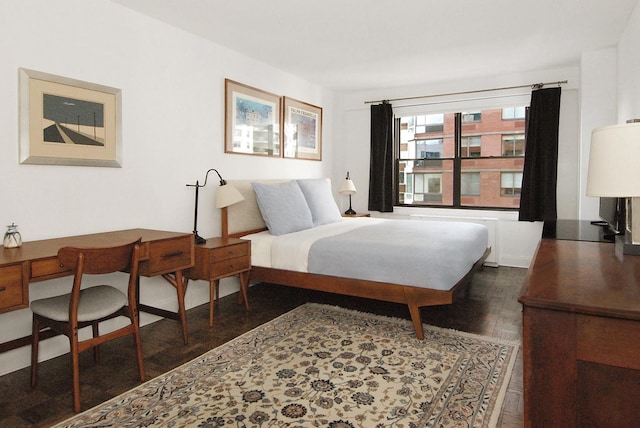 bedroom with wood finished floors