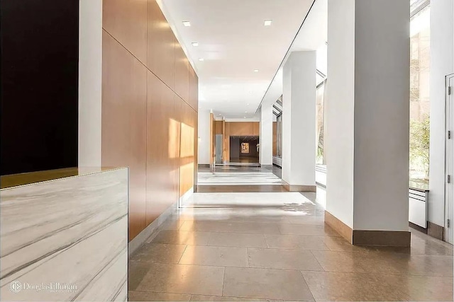 hallway featuring tile patterned flooring