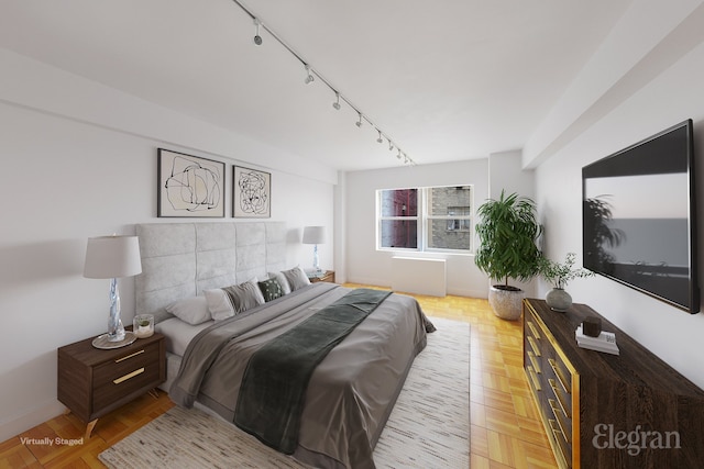 bedroom featuring track lighting