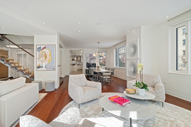 living area with a healthy amount of sunlight and wood finished floors