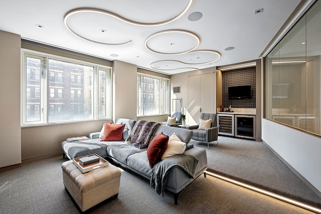 living area with carpet flooring, wine cooler, and indoor bar