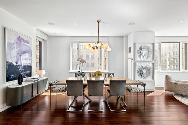 dining room with a chandelier and hardwood / wood-style floors