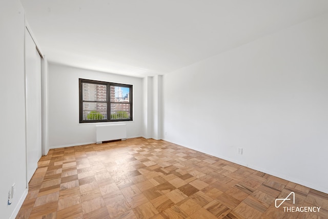 142 W End Ave Unit 6U, New York City, NY 10023 - empty room featuring radiator and baseboards