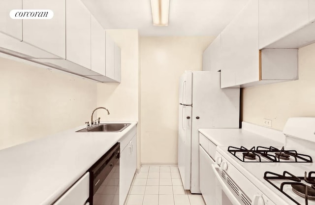 kitchen with white cabinetry, white appliances, light countertops, and a sink