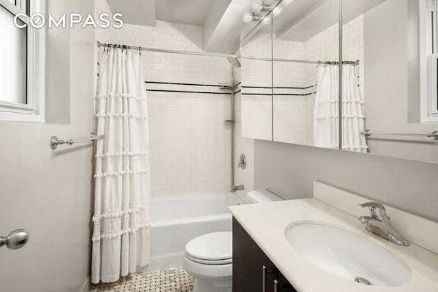 bathroom with vanity, toilet, and shower / bath combination with curtain