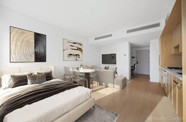37-14 34th St Unit N-4C, New York City, NY 11101 - bedroom featuring light wood-style flooring
