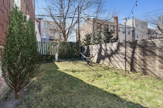 view of yard with a fenced backyard
