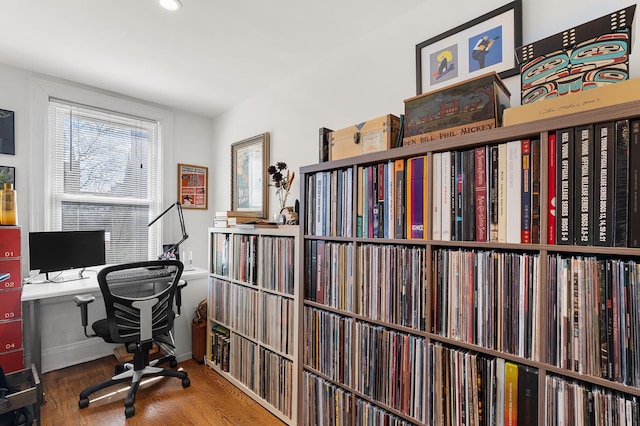 office area with baseboards and wood finished floors