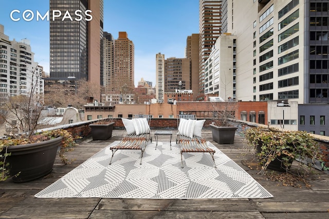 219 E 49th St, New York City, NY 10017 - view of patio with a view of city and a deck