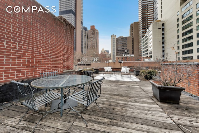 219 E 49th St, New York City, NY 10017 - deck featuring outdoor dining area and a city view