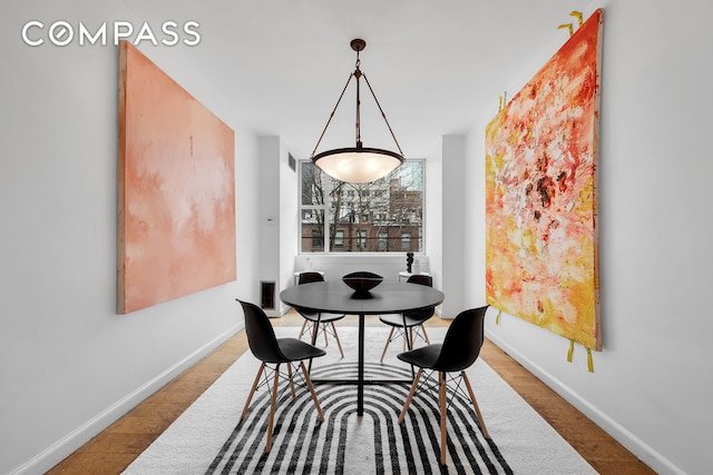 219 E 49th St, New York City, NY 10017 - dining area with baseboards and wood finished floors