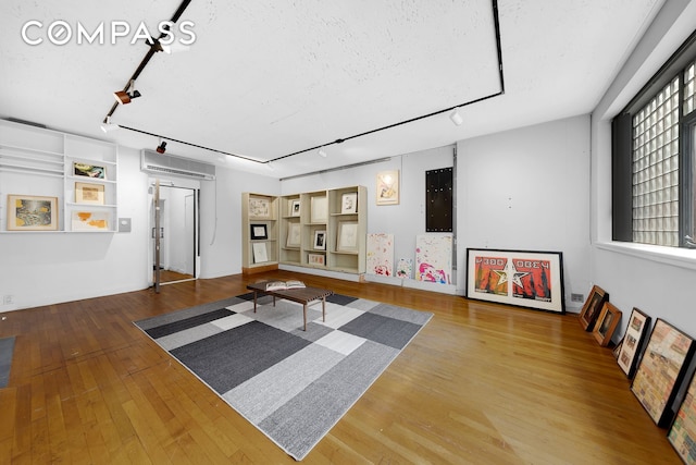 219 E 49th St, New York City, NY 10017 - interior space with track lighting and wood finished floors