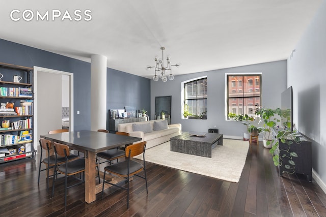 250 W St Unit 3F, New York City, NY 10013 - dining area with a chandelier, dark wood-style floors, and baseboards